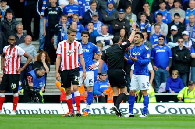 Ricardo Rocha is booked after striking Adam Lallana in Pompey's 2-2 draw at Southampton in April 2012. Picture: Allan Hutchings
