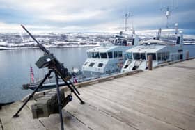 HMS Biter, Blazer, Exploit and Trumpeter have all been deployed to be a part of Nato's Exercise Steadfast Defender. Pictured is HMS Biter (nearest the jetty) and Blazer alongside in the Arctic - and a machine gun. Picture: Royal Navy