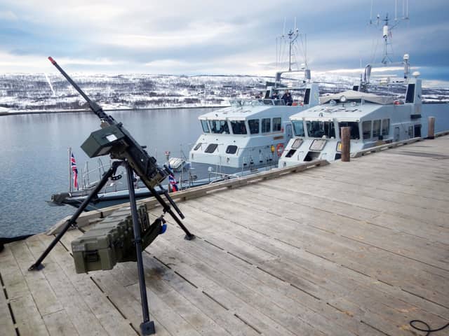 HMS Biter, Blazer, Exploit and Trumpeter have all been deployed to be a part of Nato's Exercise Steadfast Defender. Pictured is HMS Biter (nearest the jetty) and Blazer alongside in the Arctic - and a machine gun. Picture: Royal Navy