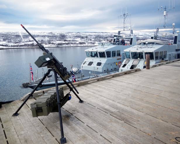 HMS Biter, Blazer, Exploit and Trumpeter have all been deployed to be a part of Nato's Exercise Steadfast Defender. Pictured is HMS Biter (nearest the jetty) and Blazer alongside in the Arctic - and a machine gun. Picture: Royal Navy