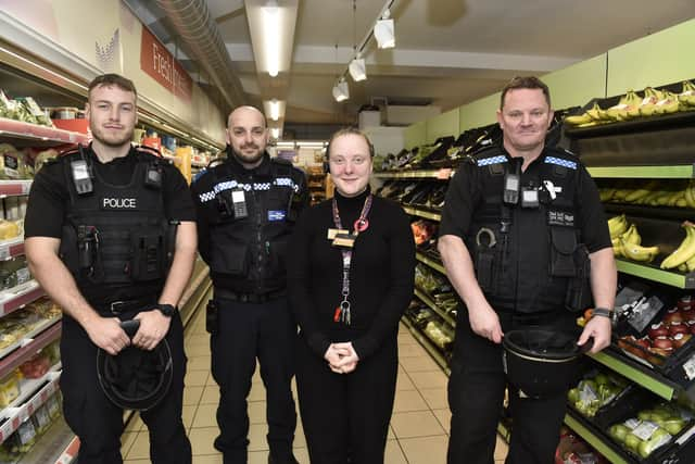 Pictured is: Daisy Potter, manager at Sainsbury's Local in Guildhall Walk, Portsmouth, with (l-r) PC Jonathan Tallent, PCSO Georgi Berkov and Sgt Paul Marshall.