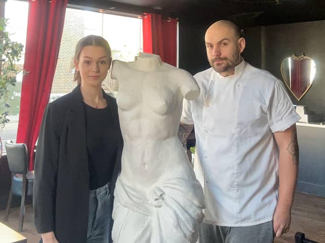 The owners of Smoke and Mirrors in Old Portsmouth, Caitlyn Odin and Jordan Thompson, have been gifted the Venus De Milo statue by Mike Barnett. 