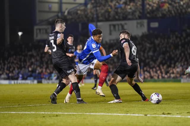 Kusini Yengi missed a sitter for Pompey before scoring from the penalty spot