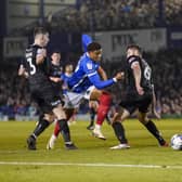 Kusini Yengi missed a sitter for Pompey before scoring from the penalty spot