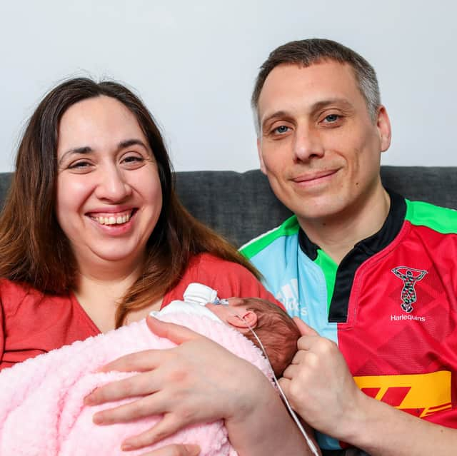 Steph Lorrabaquio and Dave Richardson with their daughter, Millie, who was born three months early on Christmas Day. They were allowed to take her home on March 11th