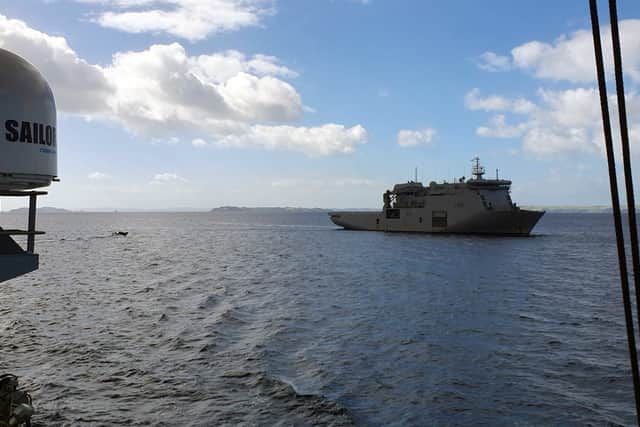 HMNZS Canterbury passes HMS Tamar off Auckland