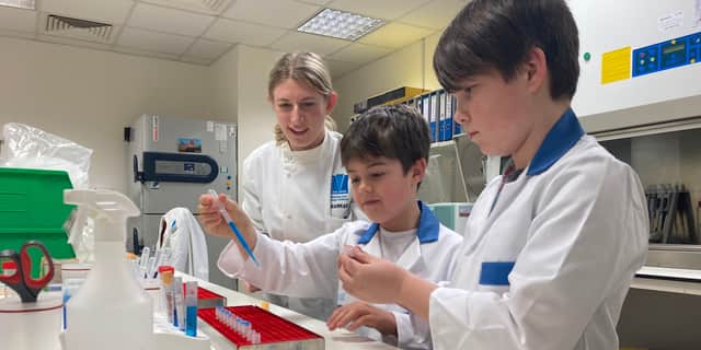 Charlie, 8, and his brother Finlay, 10, visited QA's Research Medical Unit after Charlie took part in an AI respiratory trial.