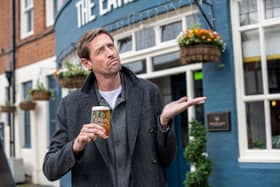 Former England footballer Peter Crouch has launched a promotion in Greene King pubs which will see 100,000 free pints on offer if it rains in Manchester next week Picture: Greene King