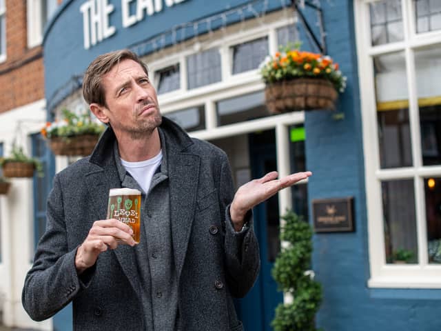 Former England footballer Peter Crouch has launched a promotion in Greene King pubs which will see 100,000 free pints on offer if it rains in Manchester next week Picture: Greene King