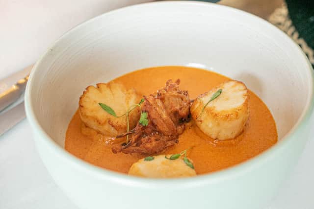 Scallops with masala sauce and an onion bhaji.
Picture: Habibur Rahman