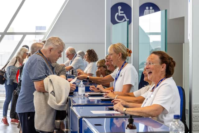 Employees at Saga welcoming passengers at the new terminal. Saga is one of the port's main customers for cruise trips.