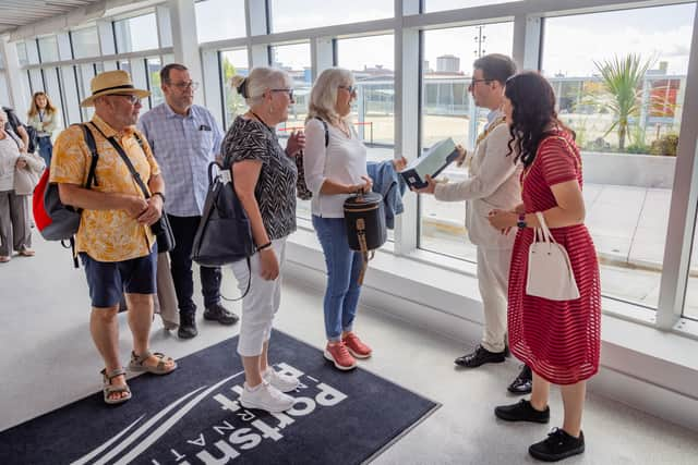 The first passenger was handed a bottle of sparkling by the mayor and mayoress of Portsmouth, Tom Coles and Nikki Coles.