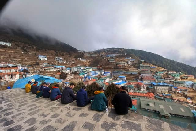 The team take a break on the hillside in Lakla. Picture: Royal Navy