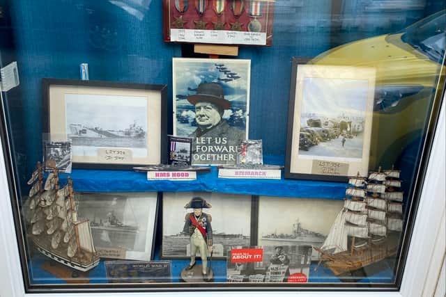 Laurie's window display of military memorabilia.