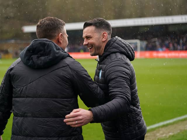 Wycombe boss Matt Bloomfield and Pompey assistant head coach Jon Harley. Pic: PA