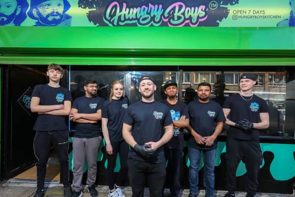 Co-owner Dan Stephenson, front, with some of the staff. Opening of Hungry Boys franchise, Market Parade, HavantPicture: Chris  Moorhouse (300324-27)