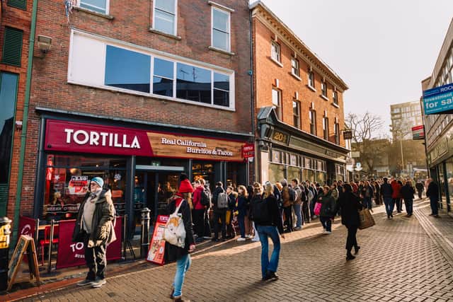 A queue from last year when Tortilla gave away 40,000 burritos.