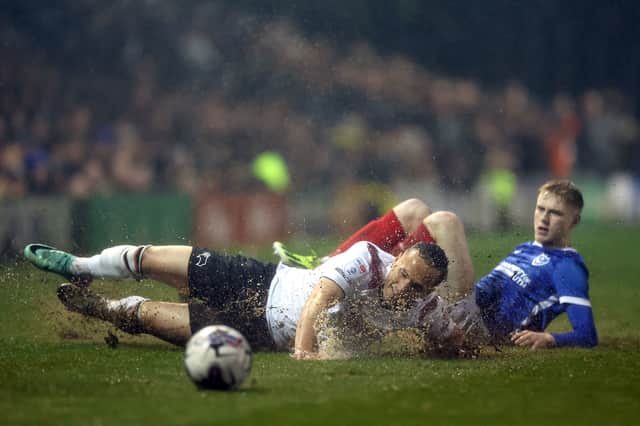 Paddy Lane challenges Derby's Kane Wilson in Tuesday night's 2-2 draw. Picture: Steven Paston/PA Wire. 