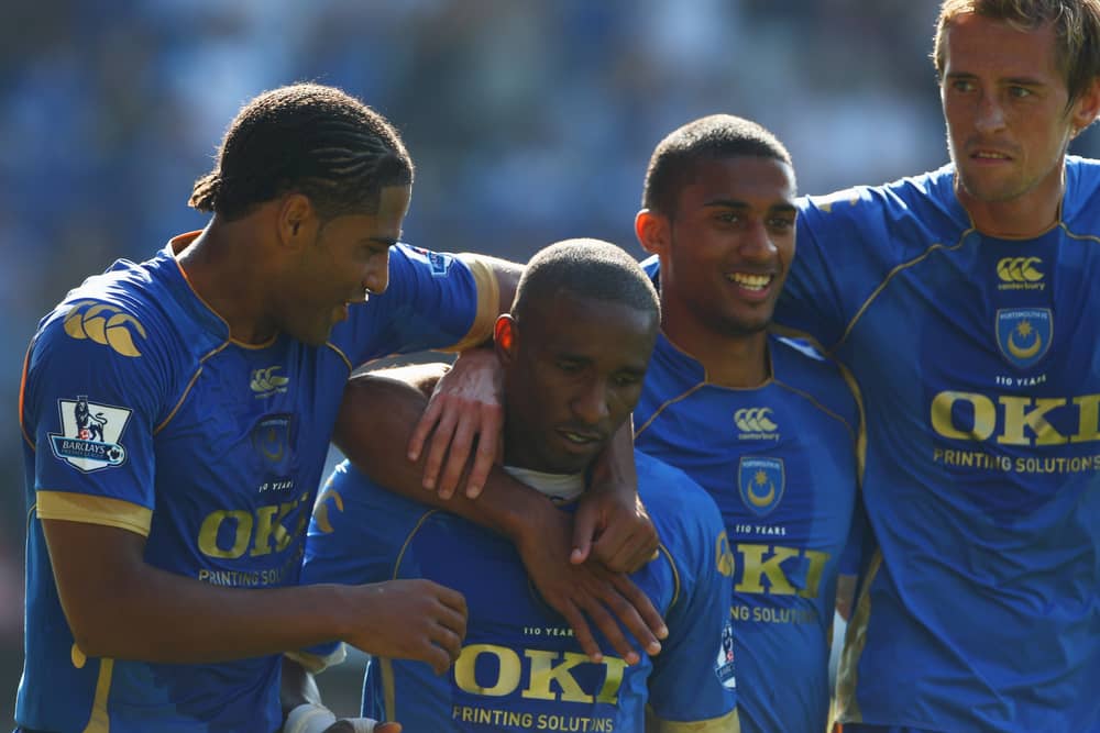 Former Pompey striker Jermain Defoe, centre