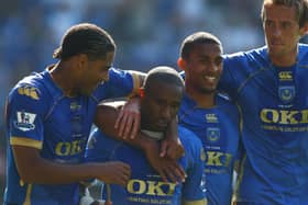 Former Pompey striker Jermain Defoe, centre