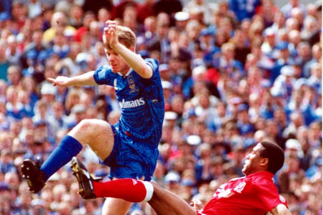 Awford in action against Liveprool's John Barnes in the 1992 FA Cup semi-final