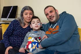 William with his mum Mihaela and dad Simon. William Howard, nine, was told by doctors his initial symptom, a twitch in his right leg, could be down to stress from playing Minecraft but in fact he has a rare and deadly disease.