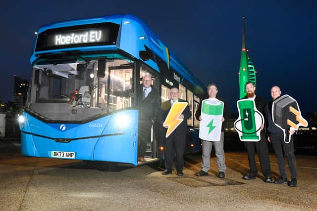 The First Bus Solent team with Spinnaker Tower lit up green to celebrate the buses' arrival.