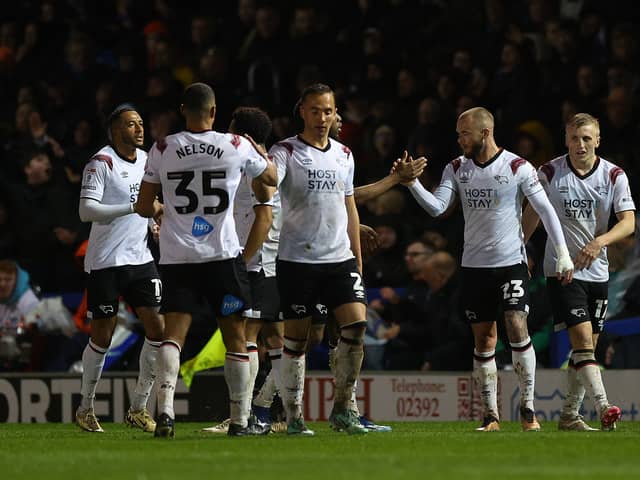 Joe Ward, second right, is congratulated after giving Derby the lead at Fratton Park last Tuesday night