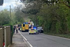 An incident on Durrants Road is causing delays in Rowlands Castle. A car can be seen overturned with emergency services at the scene.