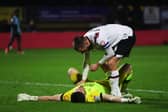 Derby keeper Joe Wildsmith is consoled by Conor Hourihane as his side drew at Wycombe - meaning a Pompey win at Bolton will seal the League One title. Pic: Getty.