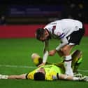 Derby keeper Joe Wildsmith is consoled by Conor Hourihane as his side drew at Wycombe - meaning a Pompey win at Bolton will seal the League One title. Pic: Getty.