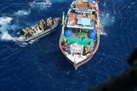 HMS Lancaster seized £33m worth of crystal meth, heroin and hasish on two separate busts in the Middle East. Pictured is the boarding team closing in on one of the vessels. Picture: Royal Navy