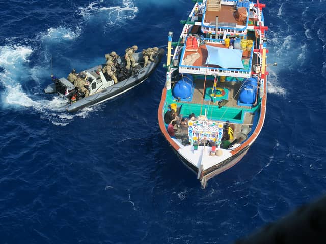 HMS Lancaster seized £33m worth of crystal meth, heroin and hasish on two separate busts in the Middle East. Pictured is the boarding team closing in on one of the vessels. Picture: Royal Navy