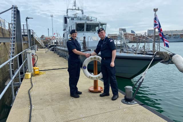 HMS Smiter has a new Commanding Officer following a major refit. From L to R: Former CO, Lt Beth Humby RN, and new CO Lt Samuel Charleston RN. Picture: HMS Smiter