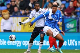 Pompey substitute Tino Anjorin tangles with Bolton's Paris Maghoma in Saturday's 1-1 draw. Picture: Gary Oakley/Getty Images.