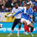 Pompey substitute Tino Anjorin tangles with Bolton's Paris Maghoma in Saturday's 1-1 draw. Picture: Gary Oakley/Getty Images.