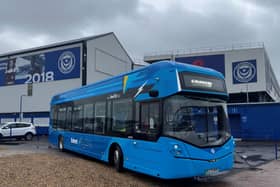 Pompey fans can get free bus travel if they wear a club shirt on Saturday's home match against Wigan Athletic.