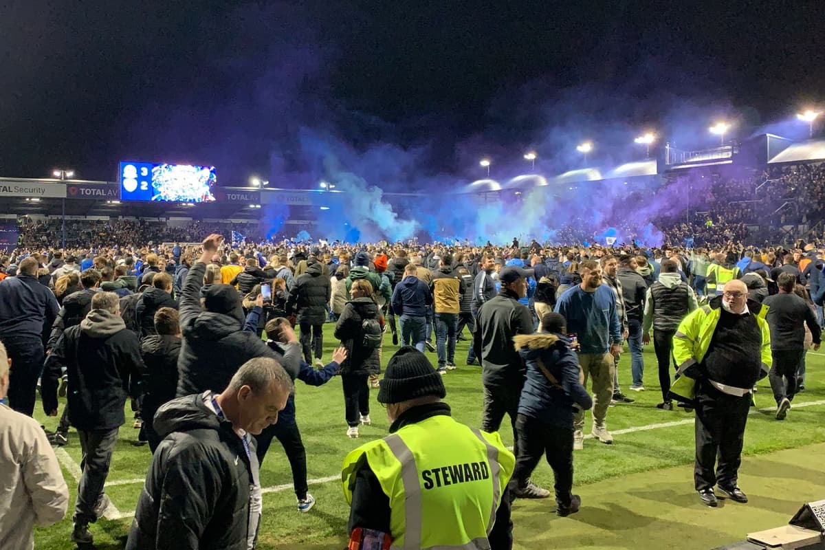 Watch as crowds storm the pitch in celebration at Pompey promotion