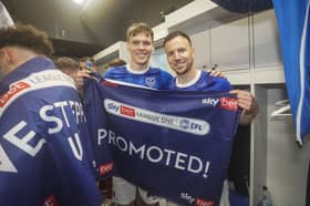 Sean Raggett, pictured with Lee Evans, finally has his Pompey promotion. Picture: Jason Brown/ProSportsImages