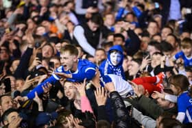 Paddy Lane crowds surf his way back to the Fratton Park tunnel as the promoton party kicks off following the Blues victory over Barnsley on Tuesday night
