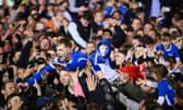 Paddy Lane crowds surf his way back to the Fratton Park tunnel as the promoton party kicks off following the Blues victory over Barnsley on Tuesday night