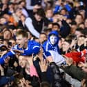 Paddy Lane crowds surf his way back to the Fratton Park tunnel as the promoton party kicks off following the Blues victory over Barnsley on Tuesday night