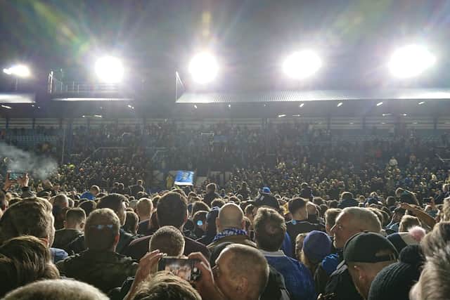 Fans on the pitch at Fratton Park after Pompey beat Barnsley 3-2 to become champions of League One - securing promotion to the Championship. 