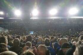 Fans on the pitch at Fratton Park after Pompey beat Barnsley 3-2 to become champions of League One - securing promotion to the Championship. 