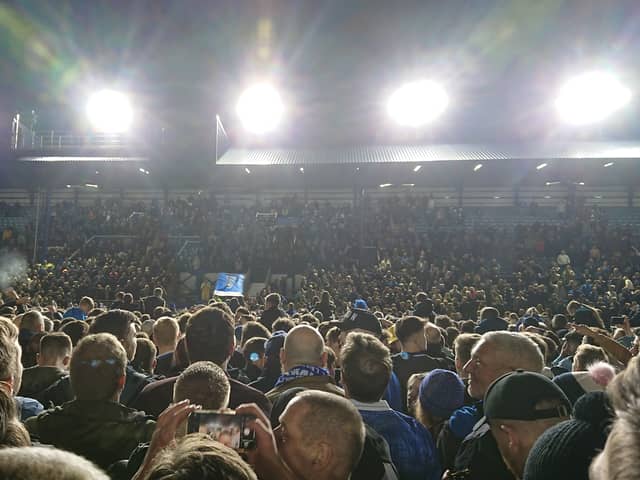 Fans on the pitch at Fratton Park after Pompey beat Barnsley 3-2 to become champions of League One - securing promotion to the Championship. 