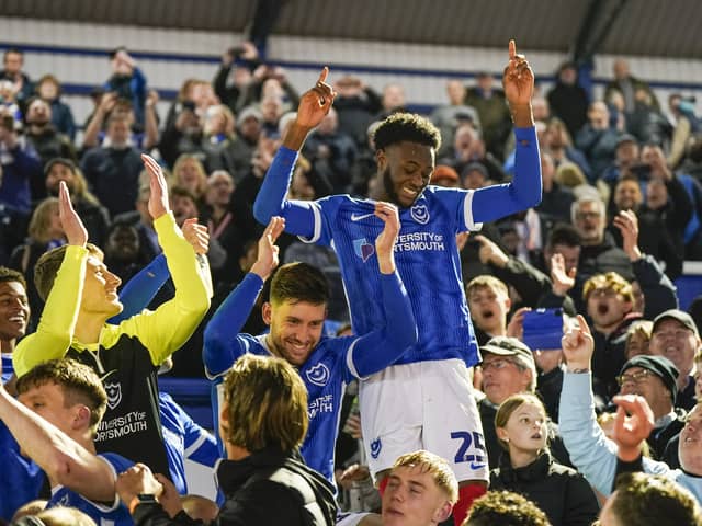 Norwich loanee Abu Kamara laps up the 'sign him up' chants after Pompey's title win against Barnsley.