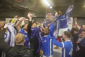 Pompey's squad celebrate promotion after victory over Barnsley. Picture: Jason Brown/ProSportsImages