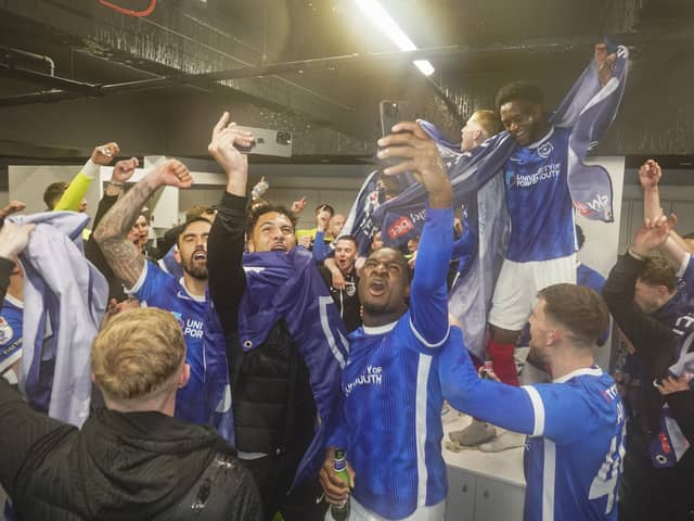 Pompey's squad celebrate promotion after victory over Barnsley. Picture: Jason Brown/ProSportsImages