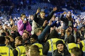 Thousands of Pompey fans ran onto the pitch to celebrate Pompey's League One title win on Tuesday night