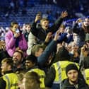 Thousands of Pompey fans ran onto the pitch to celebrate Pompey's League One title win on Tuesday night